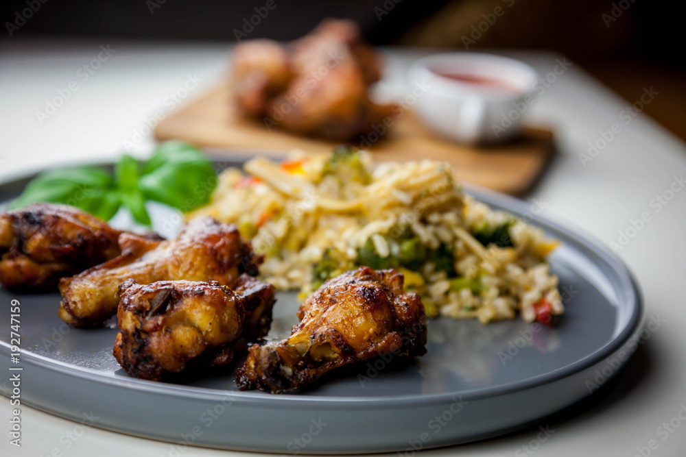 Chicken wings with sweet chilli sauce and brown rice with vegetables