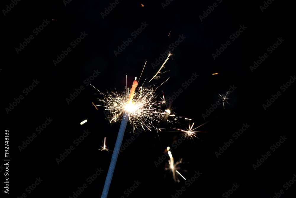 sparkler light in a black background