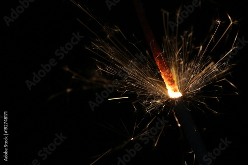 sparkler light in a black background