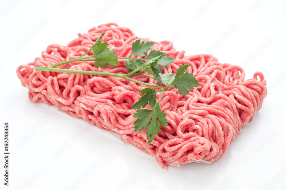 block of minced meat with parsley, isolated on white background block of minced meat with parsley, isolated on white background