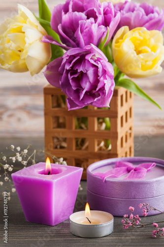 Purple yellow tulip flower  lit candles