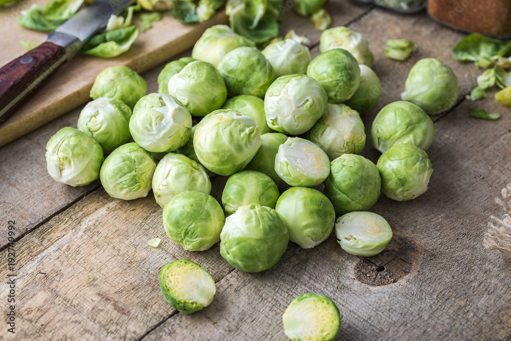 Raw brussels sprouts on jute background. Raw brussels sprouts on jute background.