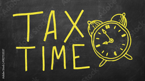 Time for tax concept, color word and clock on blackboard