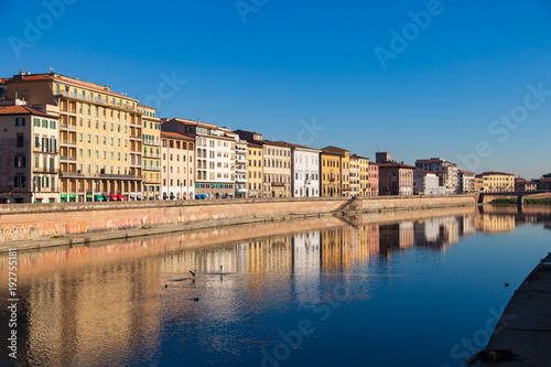 Arno river embankment with colorful old houses in Pisa. Picturesque medieval town of Pisa from bridge Ponte di Mezzo  Pisa  Tuscany  Italy.