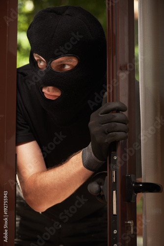 break-in of an apartment. Thief in mask