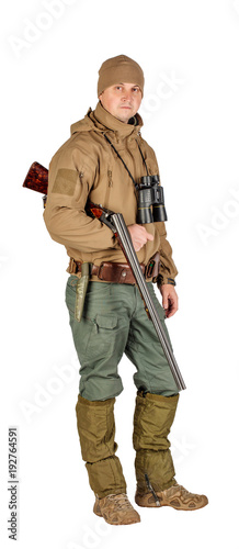 Full length portrait of a male hunter with double barreled shotgun Isolated on white background. hunting and people concept.