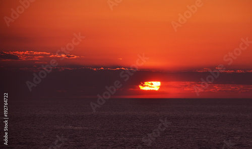 sunset in the open sea, sun close up