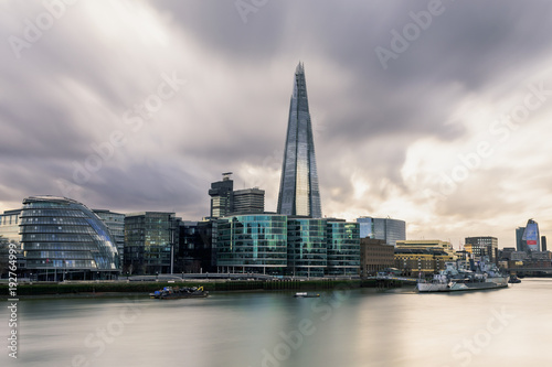 long exposure shot in the river Thames in london, facing the south side of the city centre