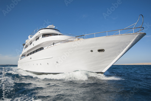 Luxury private motor yacht sailing at sea © Paul Vinten
