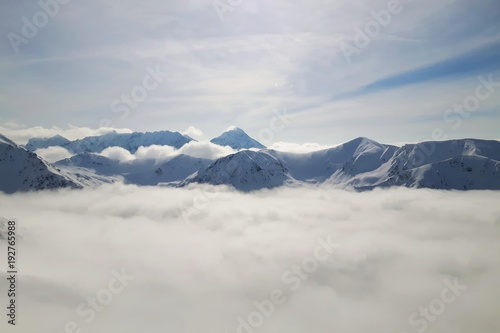 Mountain peaks over clouds © Michal