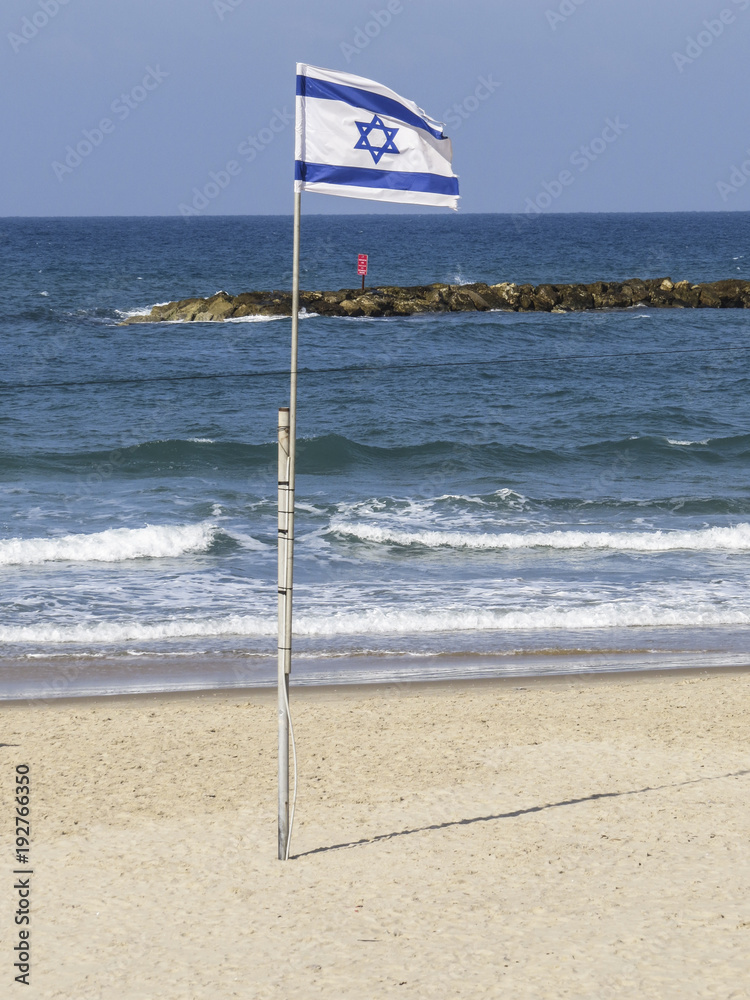Tel Aviv, Israel -  Panoramic view of the Tel-Aviv beach. Israeli flag on the beach.