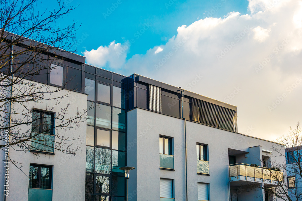 modern apartments with fluffy cloud background modern apartments with fluffy cloud background
