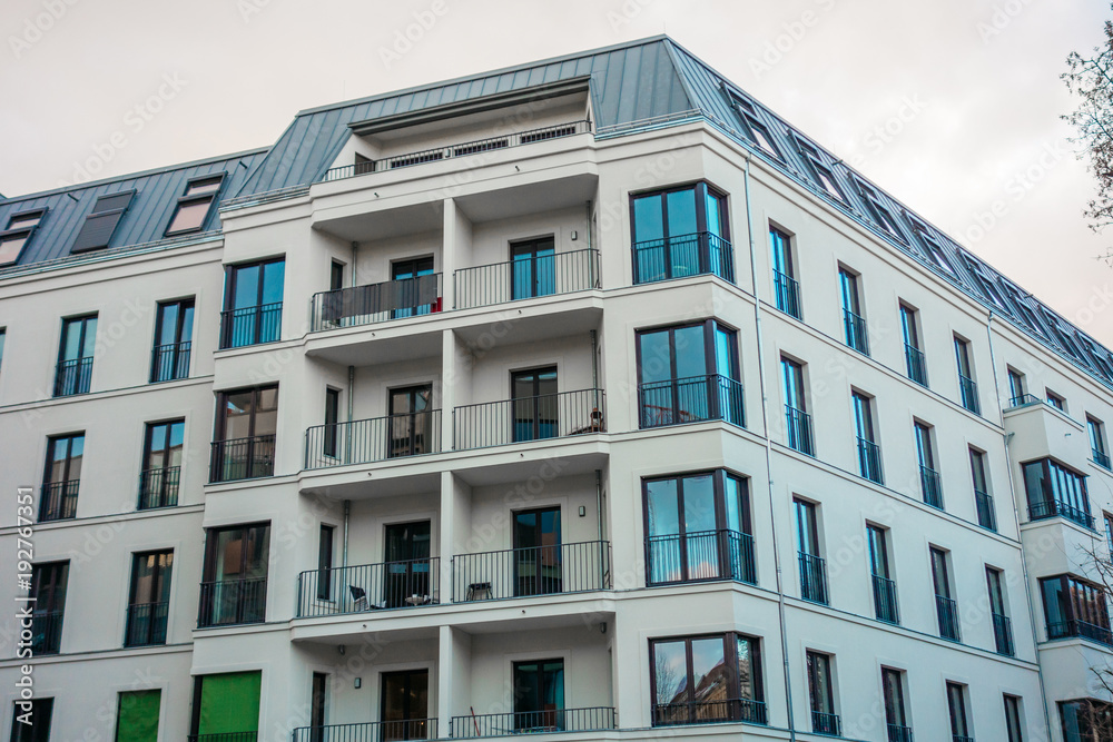 modern and white colored building with big balcony modern and white colored building with big balcony