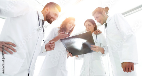 group of doctors discussing an x-ray