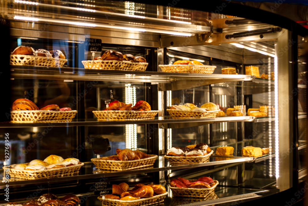 Showcase pastry shop, a lot of different cakes and pastries, desserts