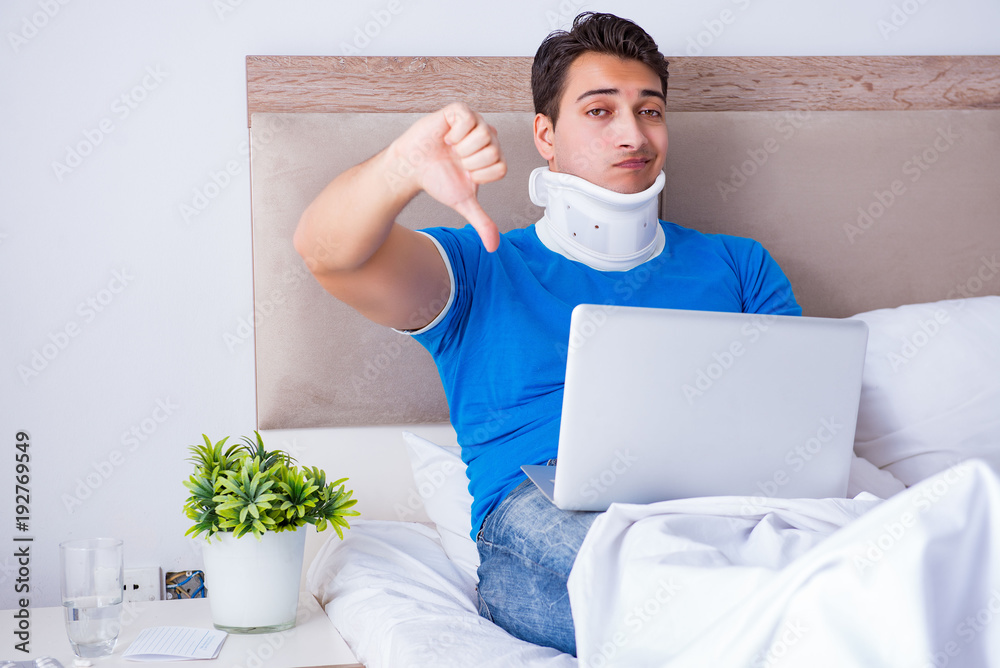 Young man with neck injury in the bed Young man with neck injury in the bed