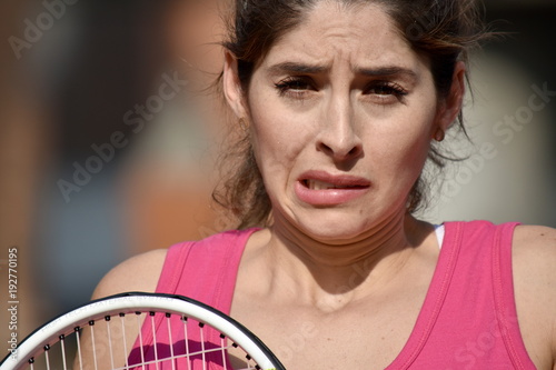 Confused Colombian Person With Tennis Racket © dtiberio
