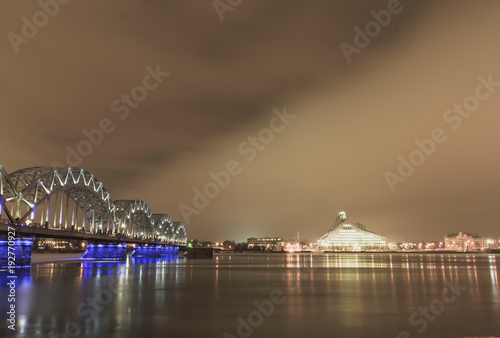 main bridgein Riga connecting the two sides of the city. Long exposure shot during the golden hour after sunrise photo