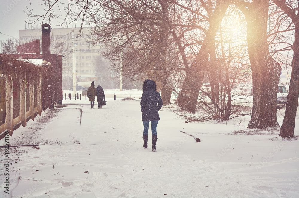 woman walking in park at winter