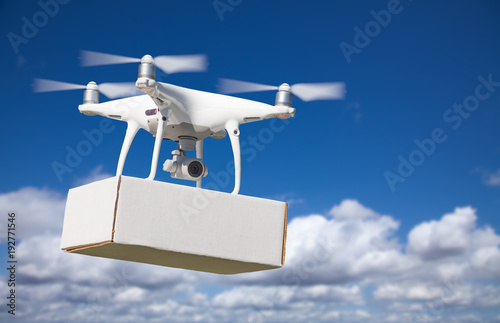 Unmanned Aircraft System (UAS) Quadcopter Drone Carrying Blank Package In The Air.