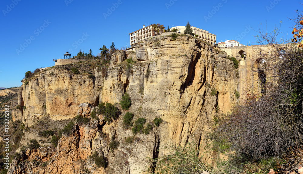 Cliffs of Ronda town with old bridge, Andalusia, Spain