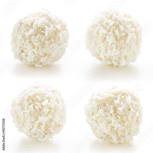 Homemade candy white chocolate and coconut on a plate on white isolated background. Set Candy  truffles snowball. Selective focus photo