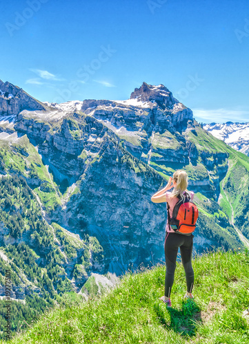 traveler screams against the backdrop of the mountain peaks, the Engelberg resort, Switzerland