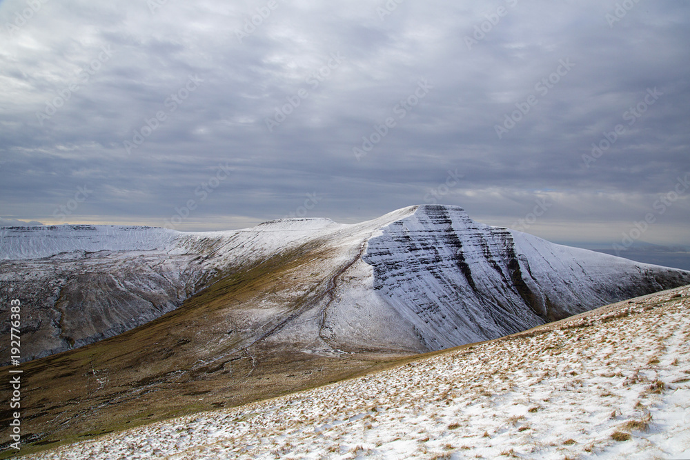 Pen y Fan and Corn Du are the highest mountains in the Brecon Beacons National Park. Panoramic format with winter snow. - obrazy, fototapety, plakaty 