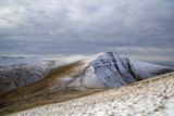 Pen y Fan and Corn Du are the highest mountains in the Brecon Beacons National Park. Panoramic format with winter snow.