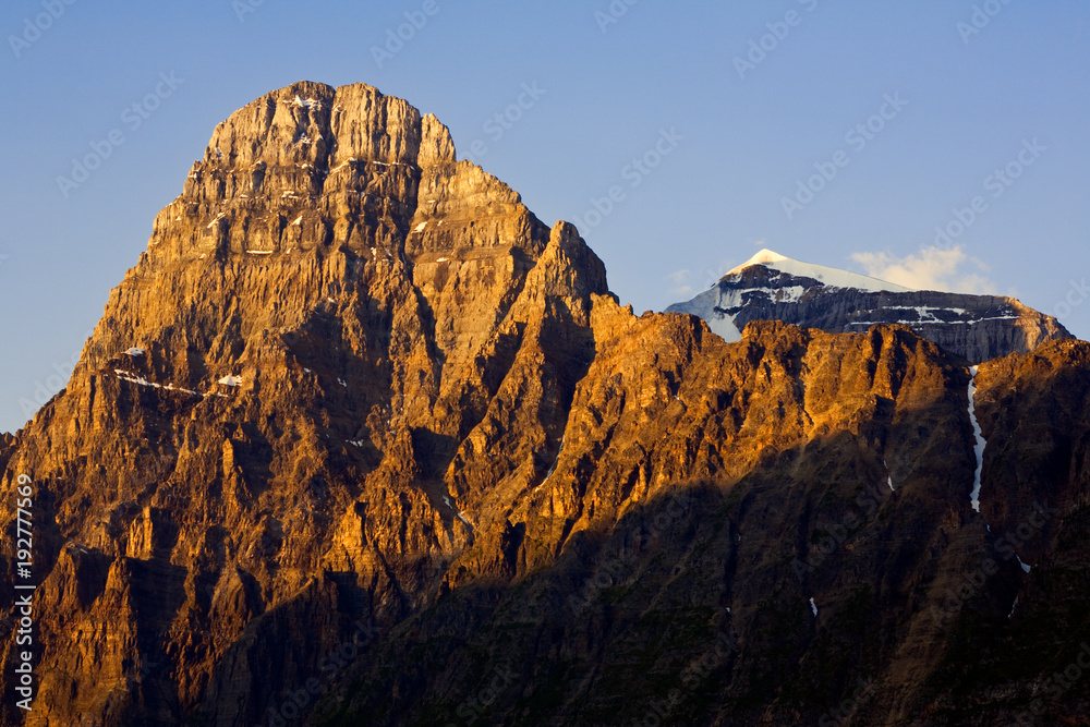Close-up of a mountain peak illuminated by early morning light