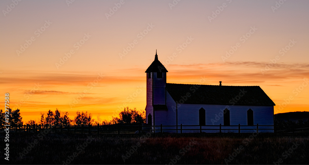An old country church at sunrise, Alberta, Canada
