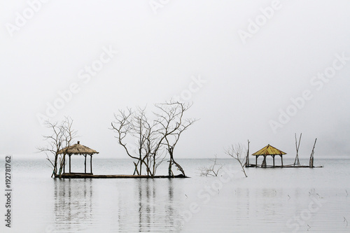 Fishing platforms on a misty Lake Tamblingan, Bali, Indonesia photo