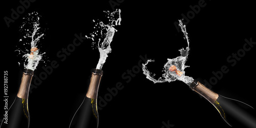 Champagne bottle and spray on black backgroun.set 1