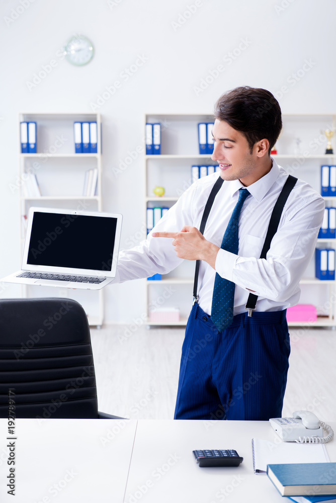 Young stylish businessman working in the office Young stylish businessman working in the office