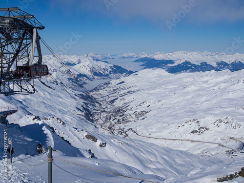 Ski slope and cable car on the ski area Three Vallees, Meribel, Courchevel. France. Winter landscape. January 2018