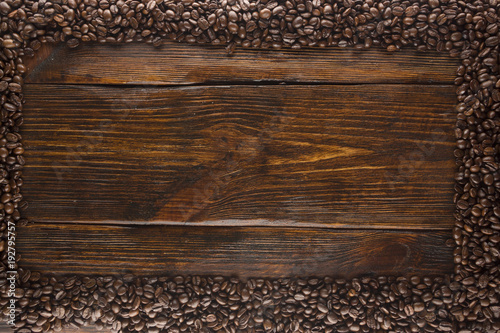 roasted coffee beans on wood texture