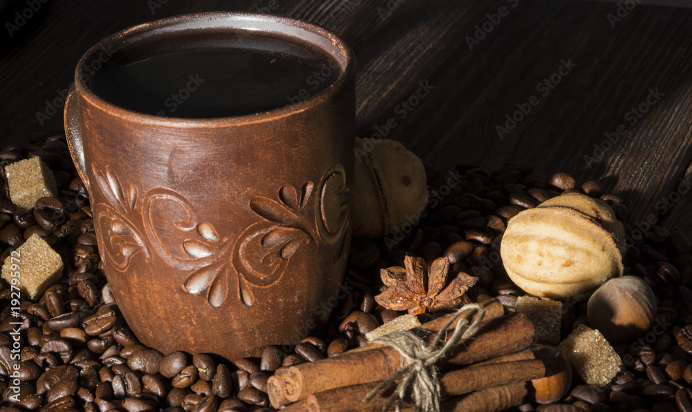 clay cup with coffee on the background of grains