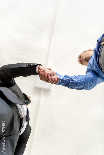 Quadro em tela Two businessmen shaking hands