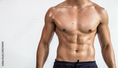 Close up bodybuilder muscular beautiful body on copy space background