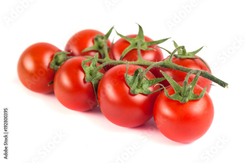 Bunch of red tasty fresh tomatos on the white background