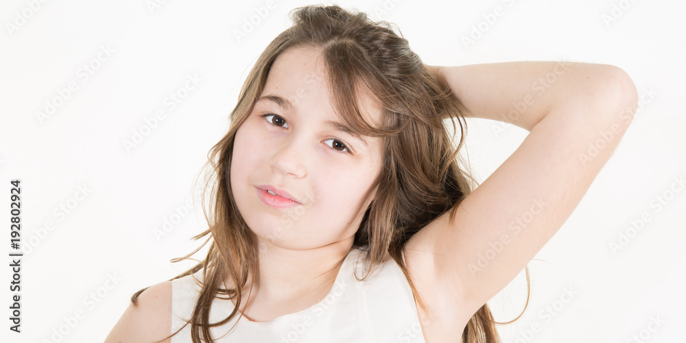 Smiling little girl in white t-shirt isolated on a white background Smiling little girl in white t-shirt isolated on a white background