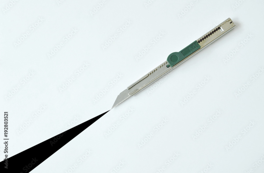 cutter slashing on white paper background cutter slashing on white paper background