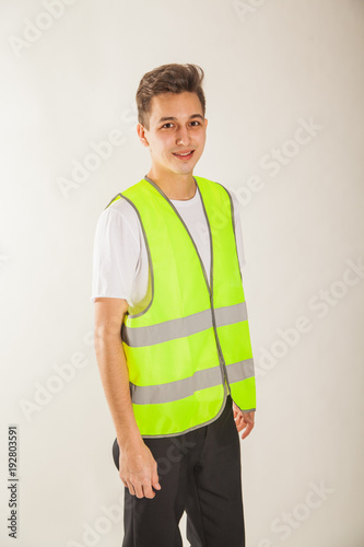 Young guy in a reflective waistcoat