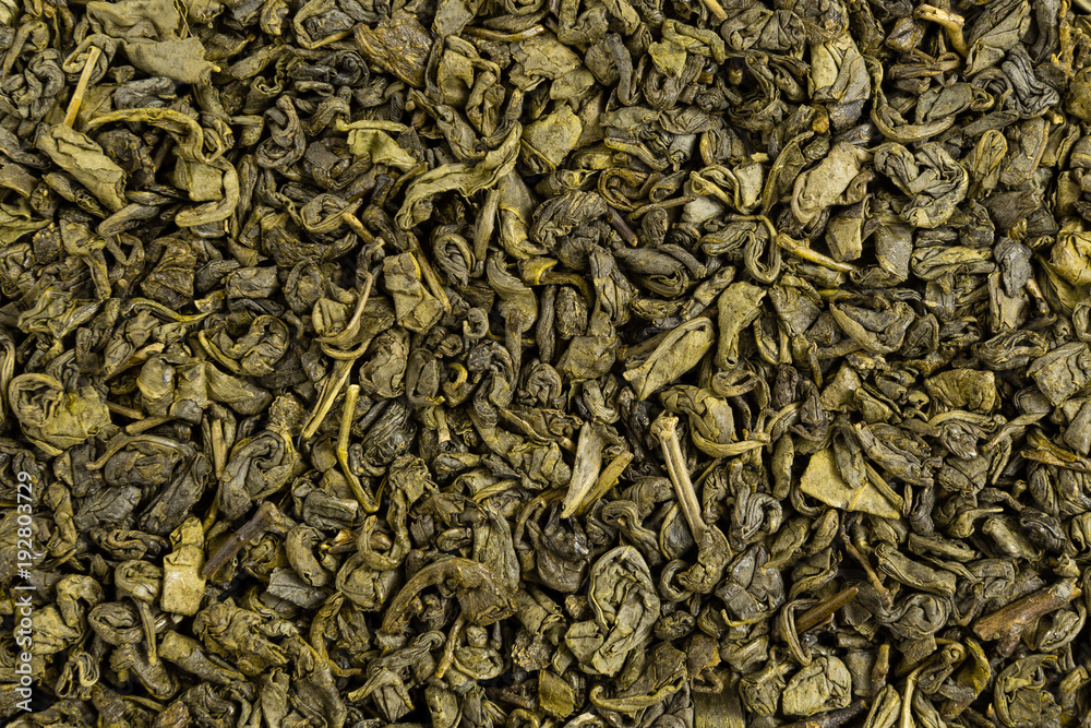 Green tea herbs texture. Organic dried tea leaves. Top view. Green tea herbs texture. Organic dried tea leaves. Top view.