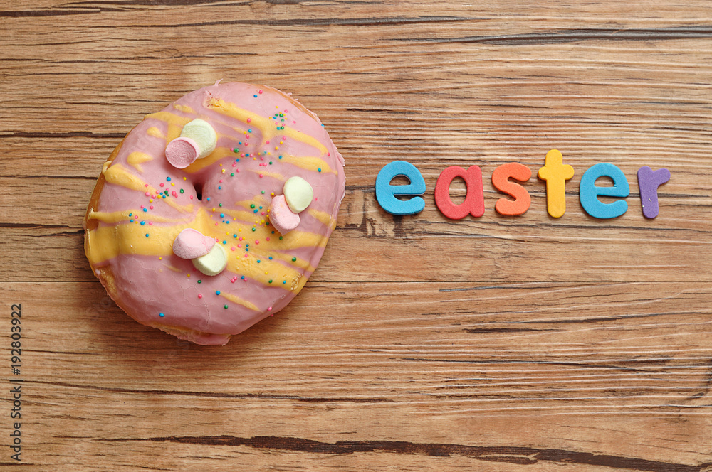 A fancy decorated doughnut with the word easter A fancy decorated doughnut with the word easter