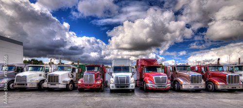 HDR image of Semi trucks lined up on a parking lot