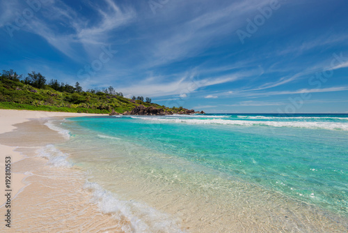 Sandy beach with turquoise sea on Paradise island.