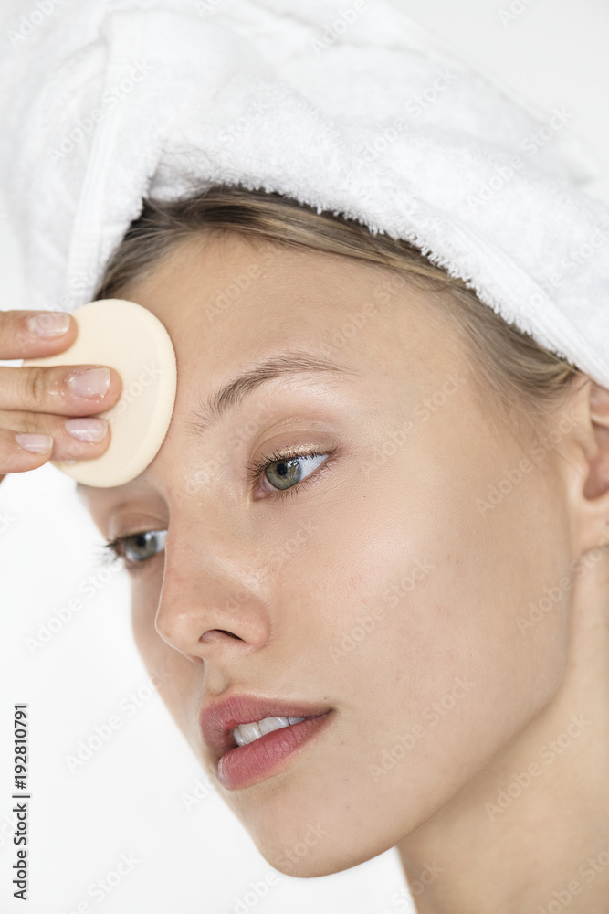 Portrait of white woman doing her daily makeup routine Portrait of white woman doing her daily makeup routine