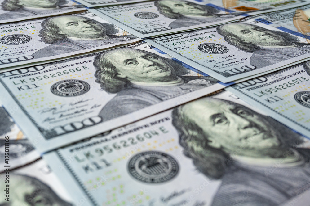 Hundred dollar bills close up as background with shallow depth of field Hundred dollar bills close up as background with shallow depth of field