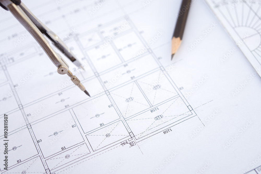 Desk work table architect with drawing home plan building and stationary in home office includes copyspace for add text or graphic Desk work table architect with drawing home plan building and stationary in home office includes copyspace for add text or graphic